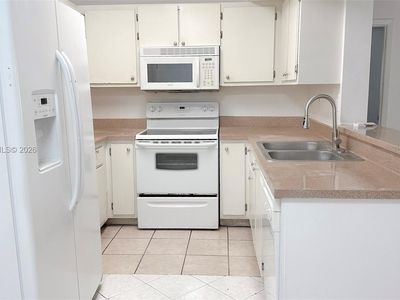 9491 Palm Cir S APT 103